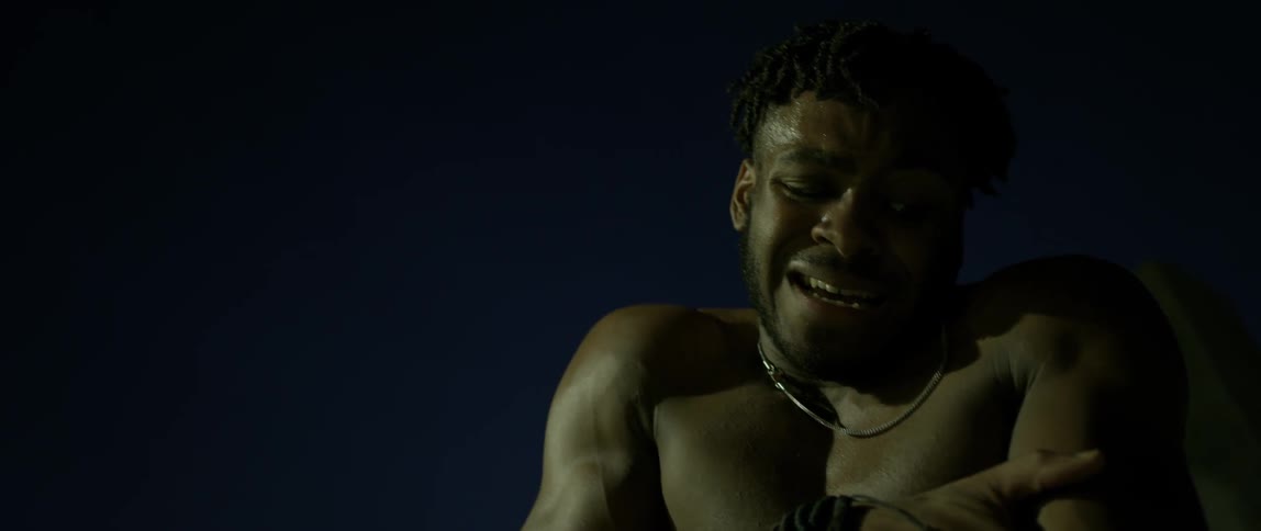 A man is in pain and grabbing his arm after what looks like an injury
