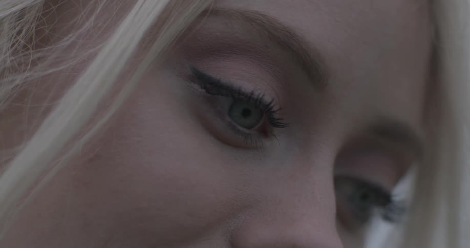 A woman is thinking and looking down at something