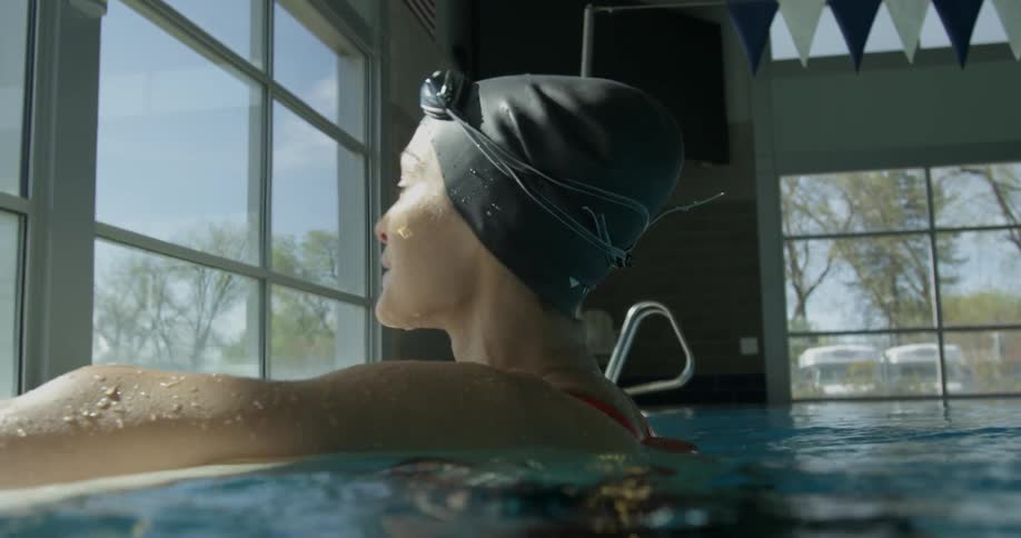 Woman swims in an indoor pool