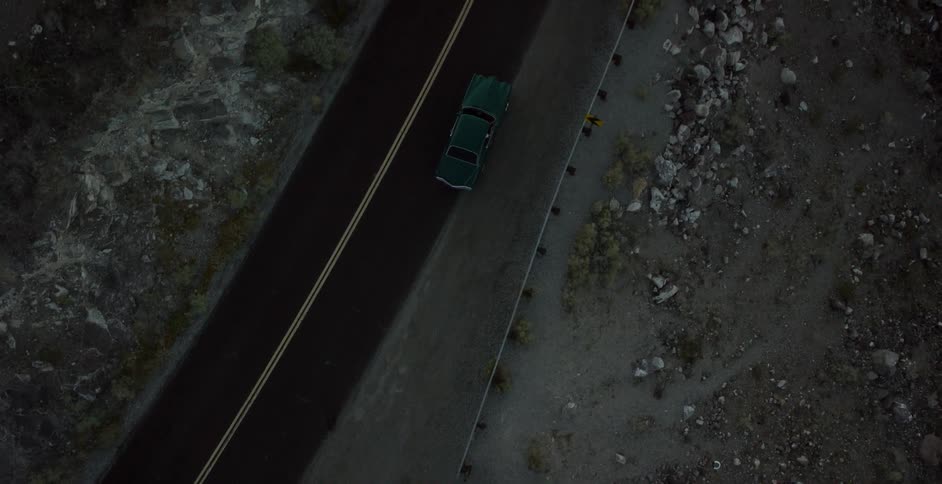 A car pulls out onto the road and drives off