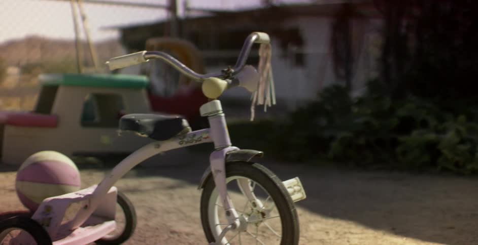 Desert yard littered with children's toys