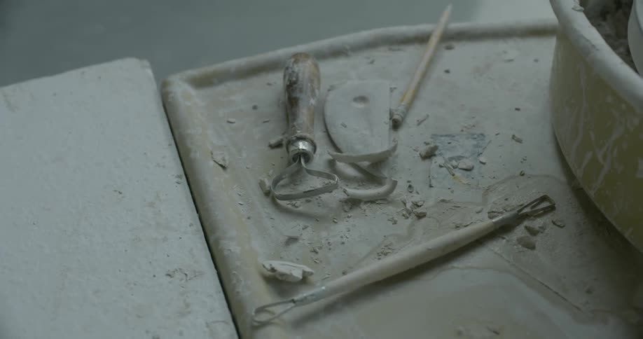 A bunch of clay pottery tools are shown close up
