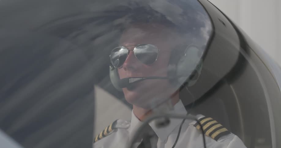 Pilot sits in a cockpit