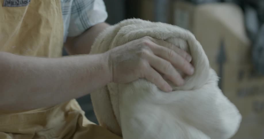 A man is drying off his hands with a towel