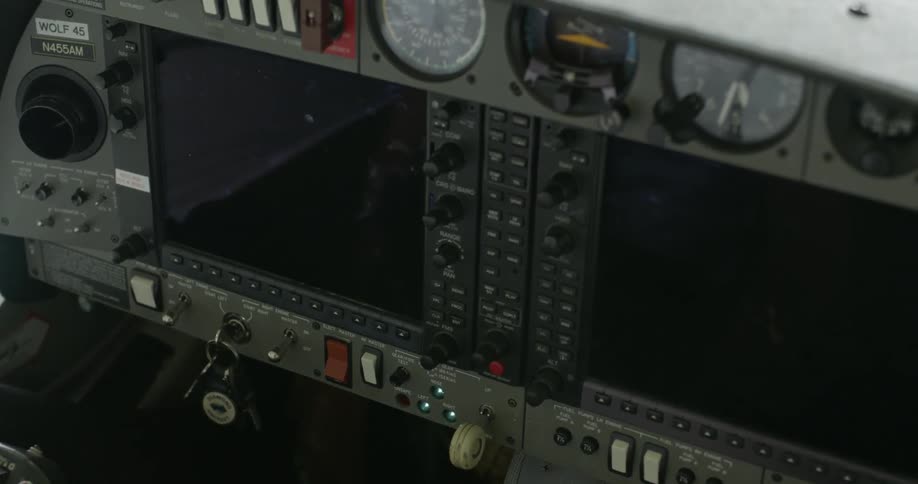 Keys swing in the ignition under screens and switches in a small plane