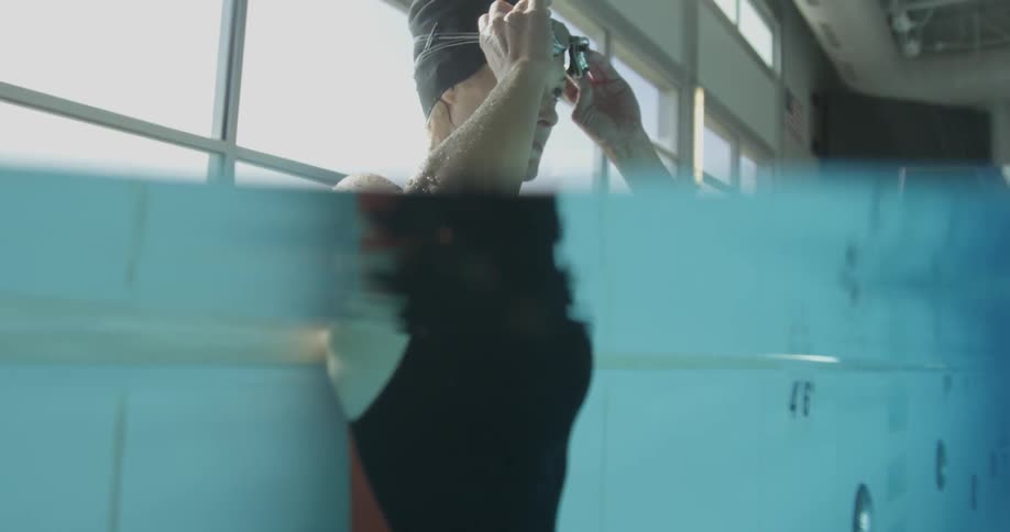 Woman swims in indoor pool