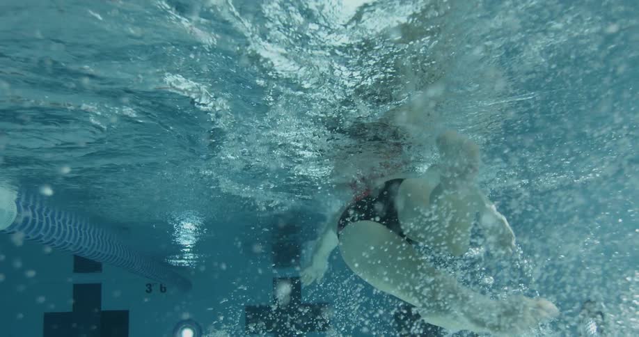 A person swims in a pool