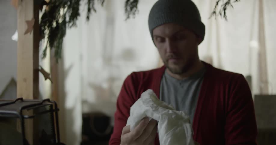 Someone is picking up and looking at a baby dress