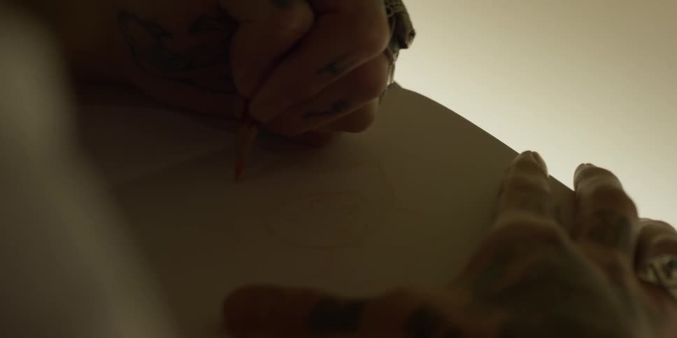 Person sketching in sketchbook