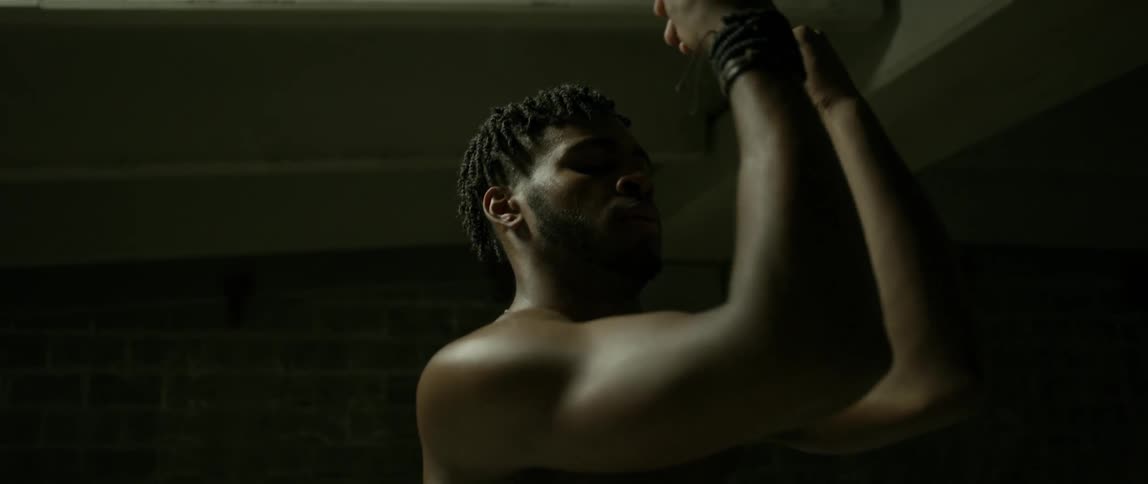 A man is dancing in the dark room