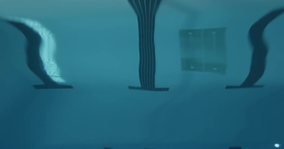 The pool water is clear from above with nobody inside