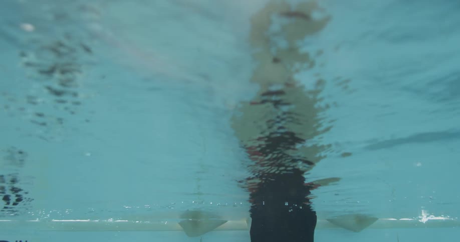 A person is floating in the water spinning around