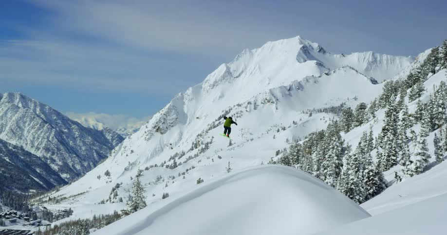 A person is doing a huge jump while skiing
