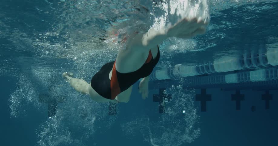 Woman swims in pool