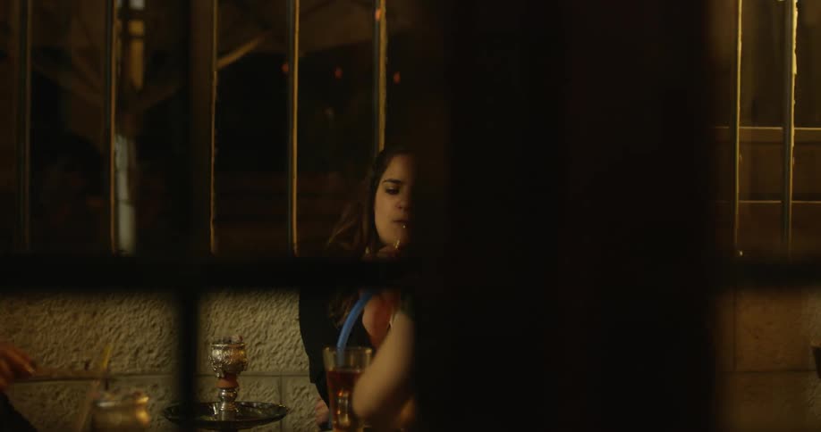 Two women sit at a table eating