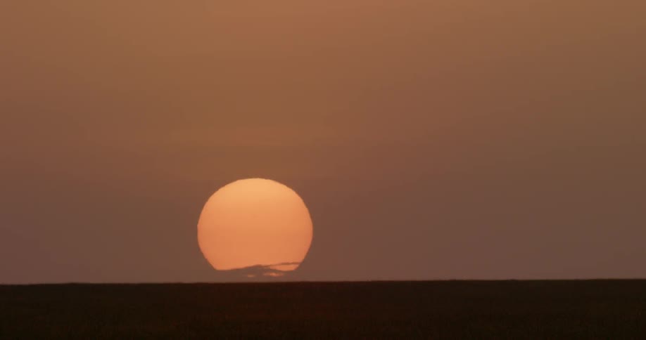 The sun is making the sky crimson as it sets