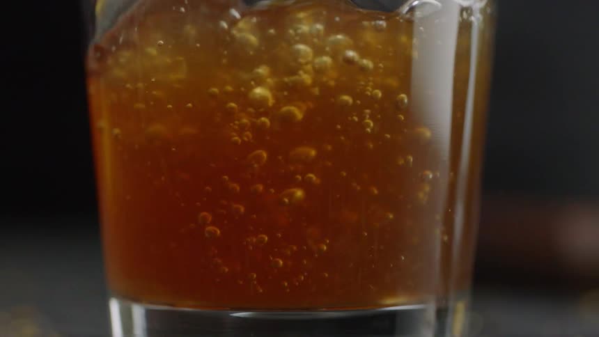 A glass is filled with beer