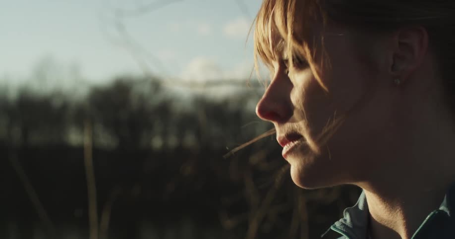 A woman is thinking in the sun