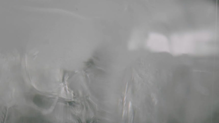 The ice cube is turning around in a circle