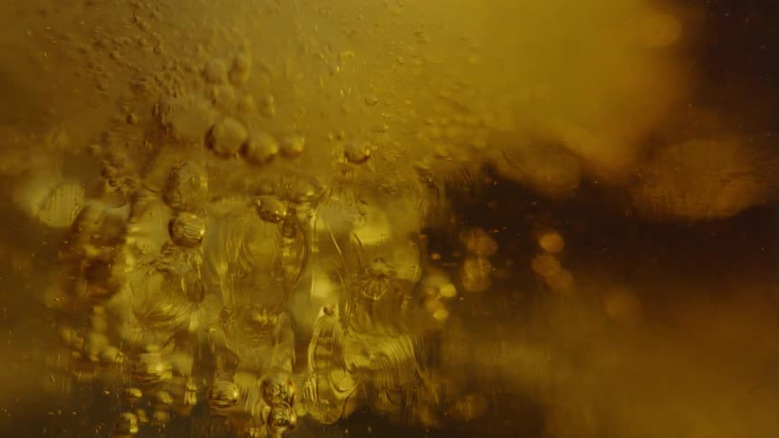 The glass is full of liquid and ice