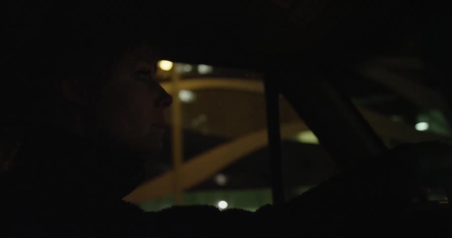 Person driving a vehicle at night time