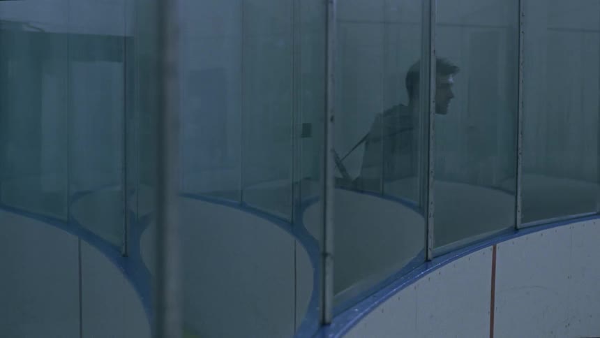 A man walks past the rink window
