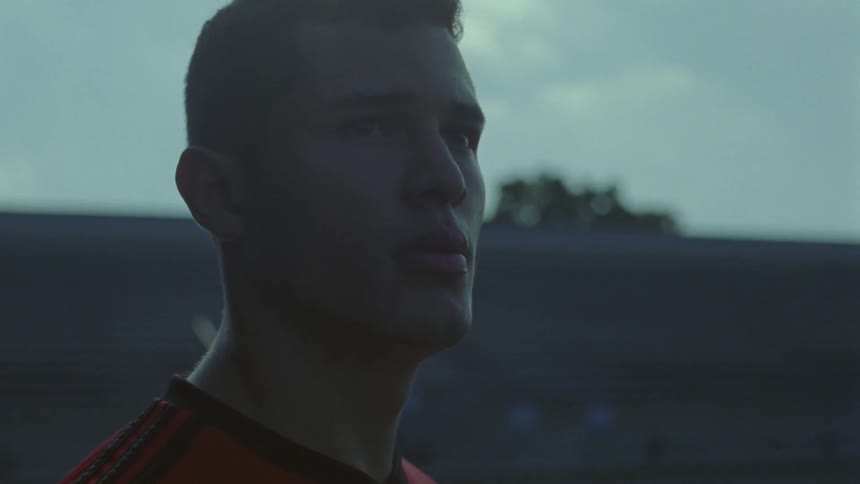 A man is looking out over a field