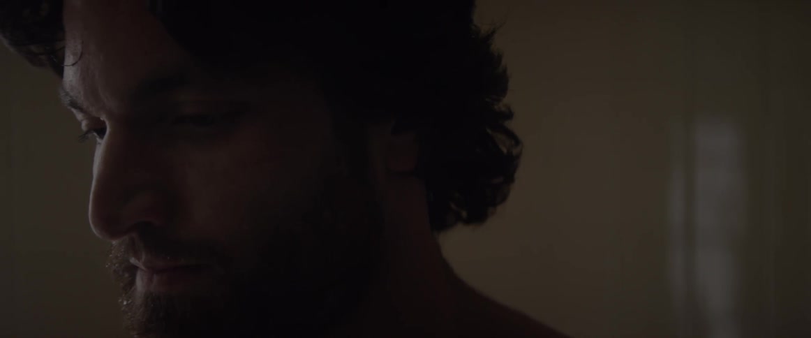 A man is chewing something in his mouth