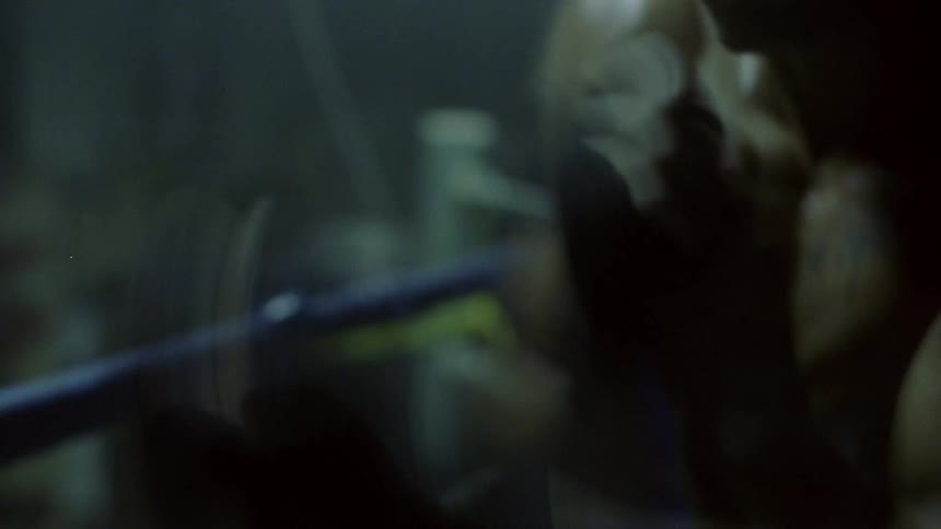 A man is shadow boxing in a boxing ring