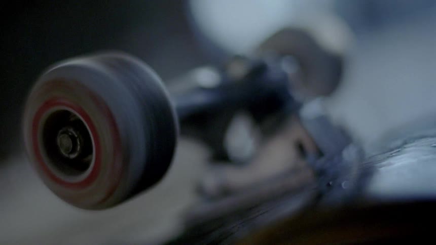 A spinning skateboard wheel comes to a stop