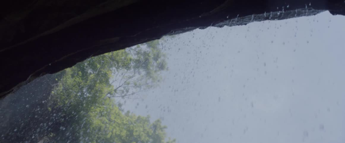 Water pours off of a waterfall