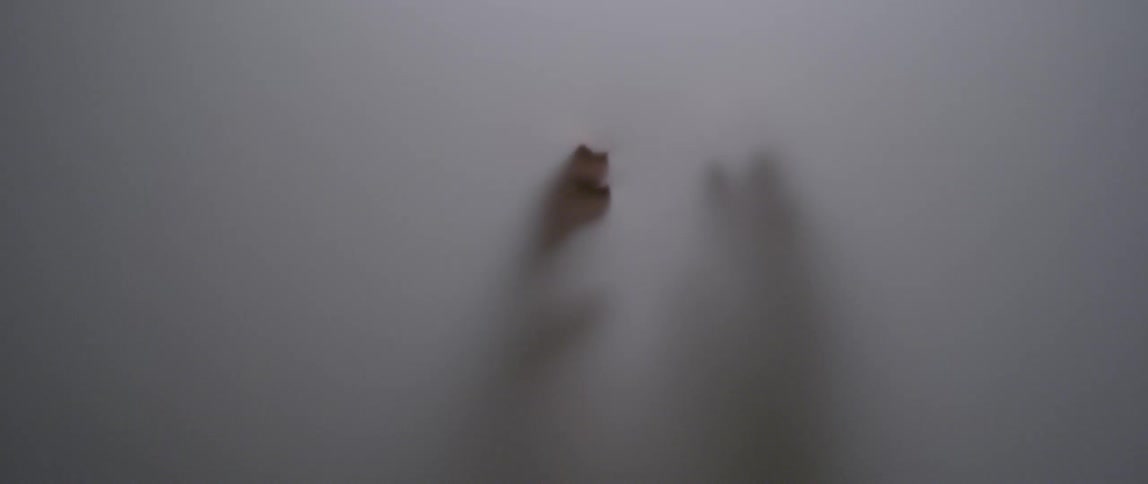 The white screen is blocking the person's hands