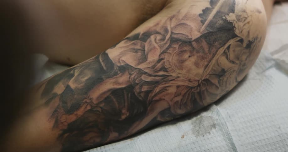 A tattoo on an arm is completed