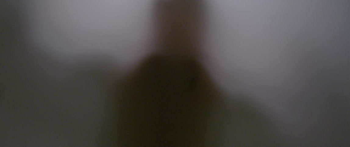 A shadow dances behind a cloth