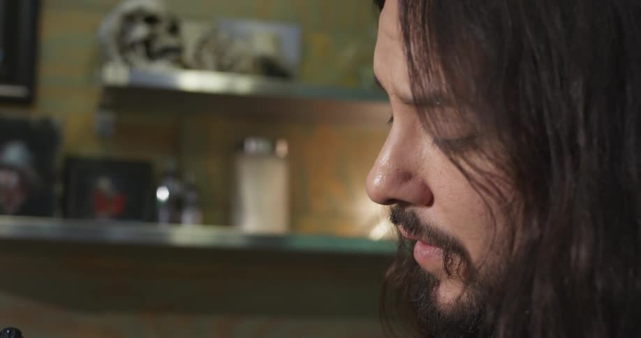 A man concentrates on a task