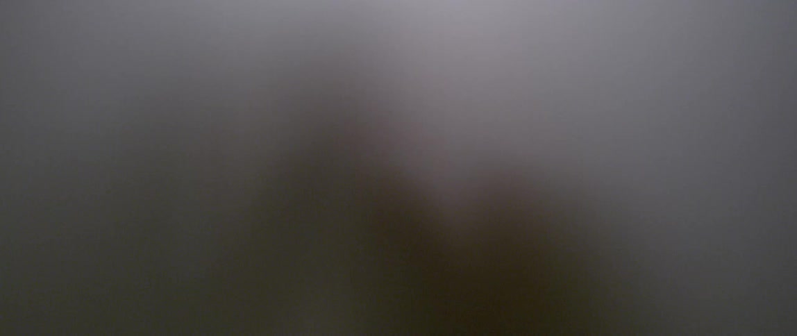 Shadowy blob moves its hands