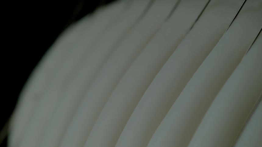The white blades move slowly with the wind