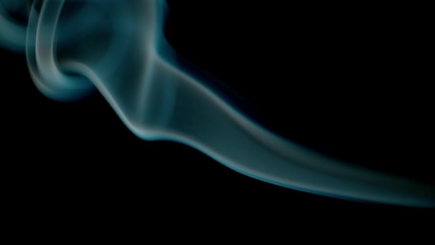 Blue smoke is swirling through the air