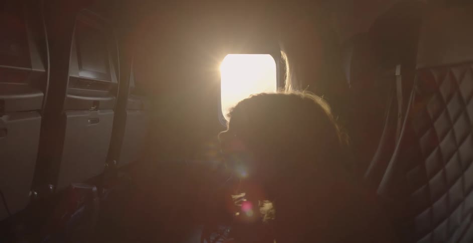 A person is sitting in an airplane waiting