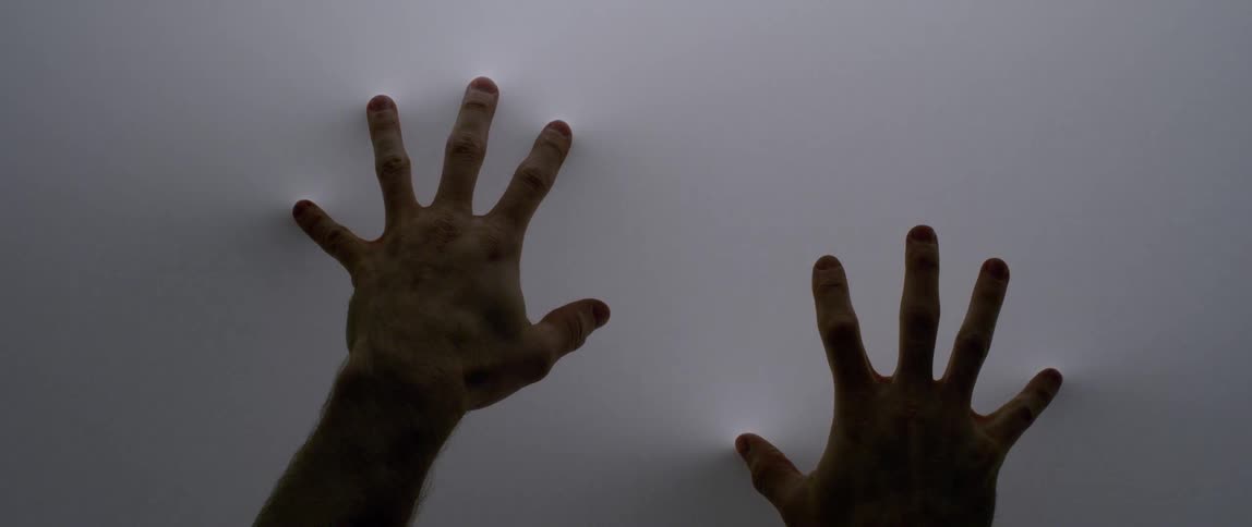 Two hands move along the white screen