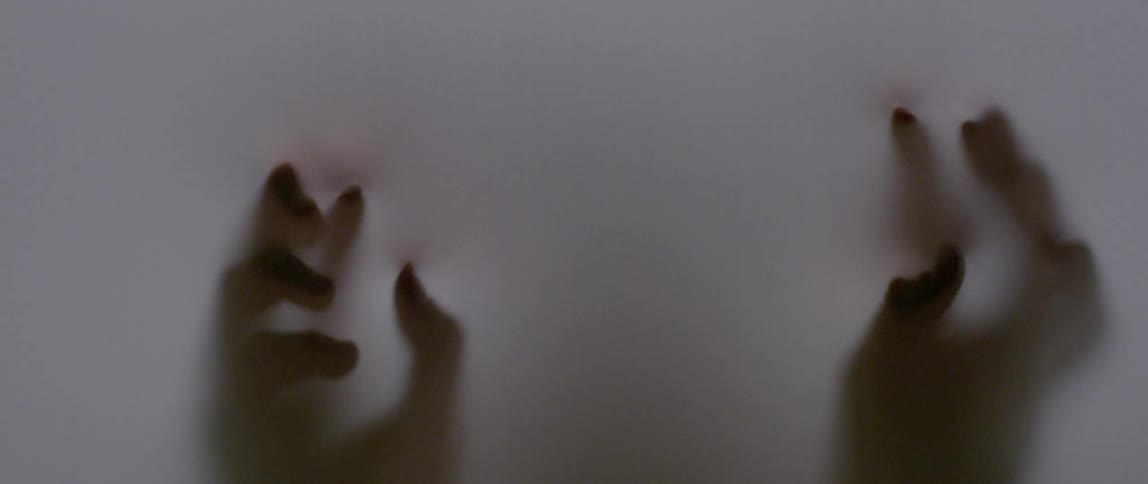 Hands rub on a translucent sheet