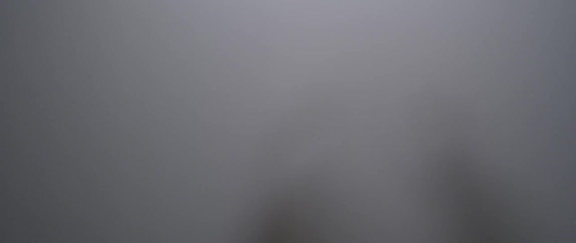 A person rubs their hands on a translucent cloth