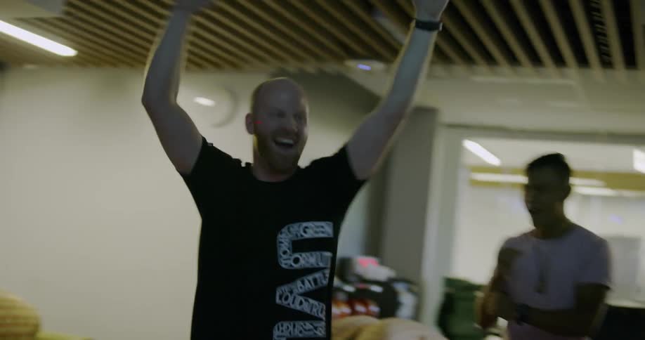 Someone is bowling a strike and celebrating