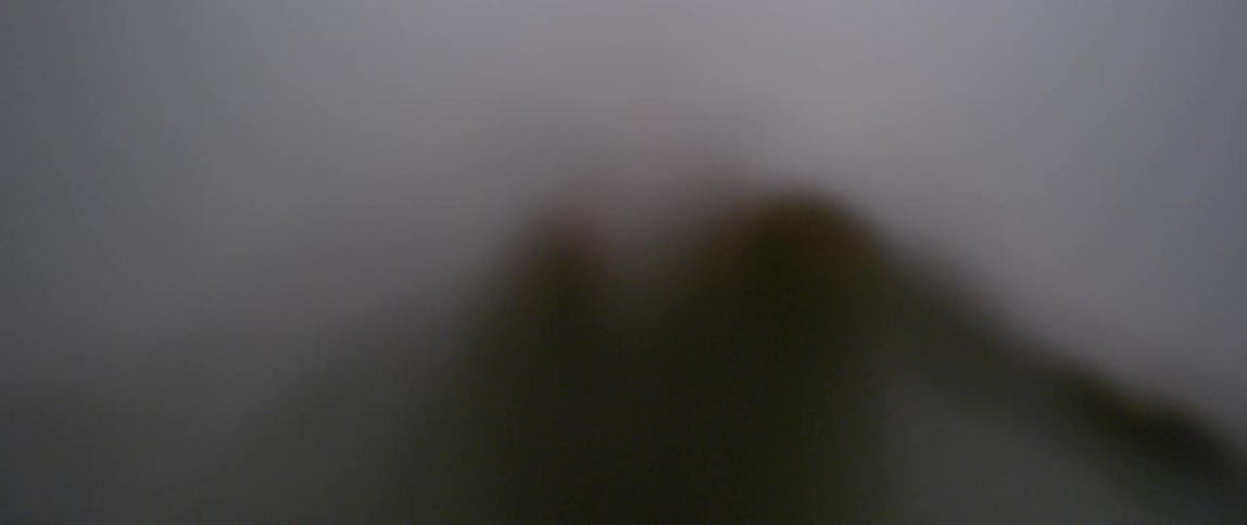 Person moving behind a white screen
