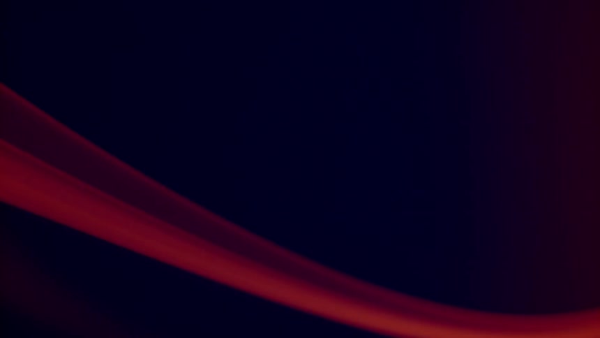 A red ribbon is filmed extremely up close