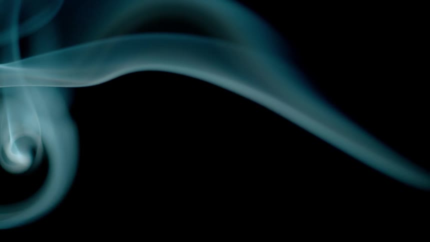 A wisp of smoke curls and drifts in abstract