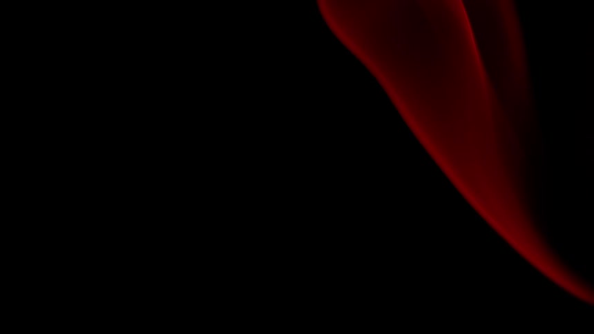 An orange flame burns in darkness