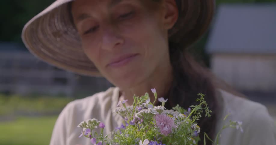 Woman picks a bouquet of flowers