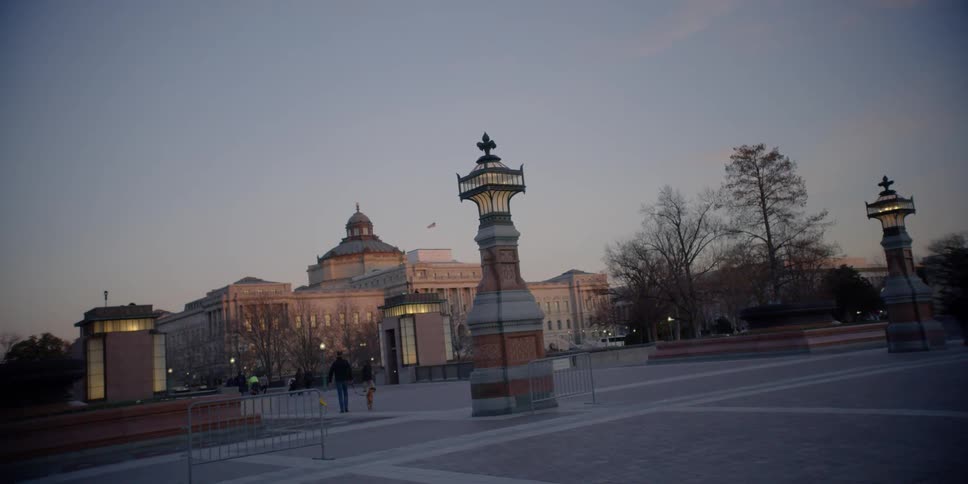 A large gathering space in the middle of a city is filmed