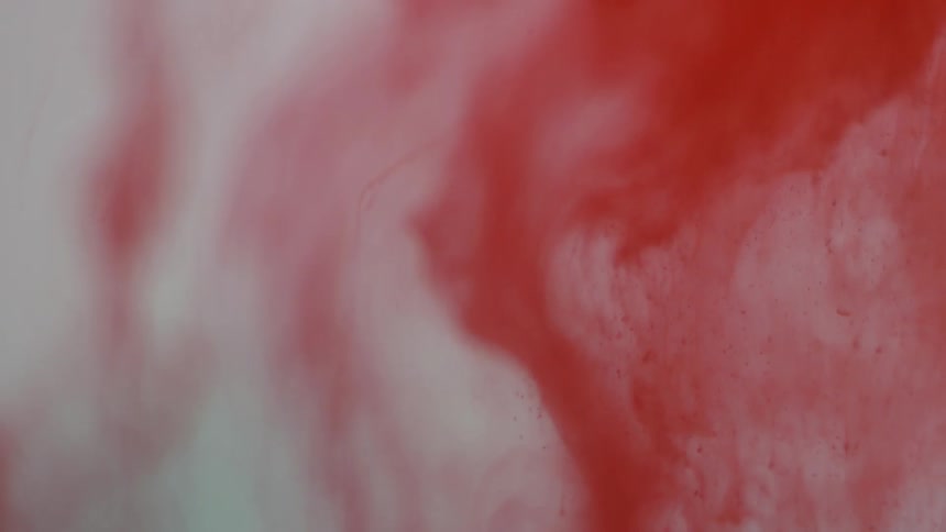 Some red clouds swirling around a grey area